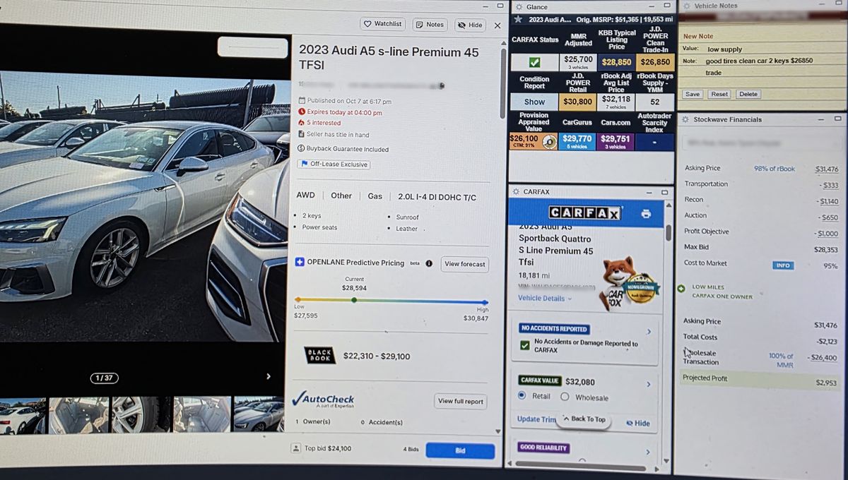 One of Kevin's screens: a 2023 Audi A5 auction listing on OPENLANE, next to its Carfax report, market values from MMR, KBB and J.D. Power, and a Stockwave panel working out the maximum bid.